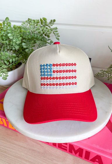 This neutral trucker hat with a red bill is the cutest way to show off your patriotic spirit this summer! The embroidered red, white, and blue floral design creates a unique American flag look that feels both festive and feminine. It’s perfect for the 4th of July, backyard BBQs, lake days, and all your sunny celebrations. With a adjustable fit, it’s as comfortable as it is eye-catching. 