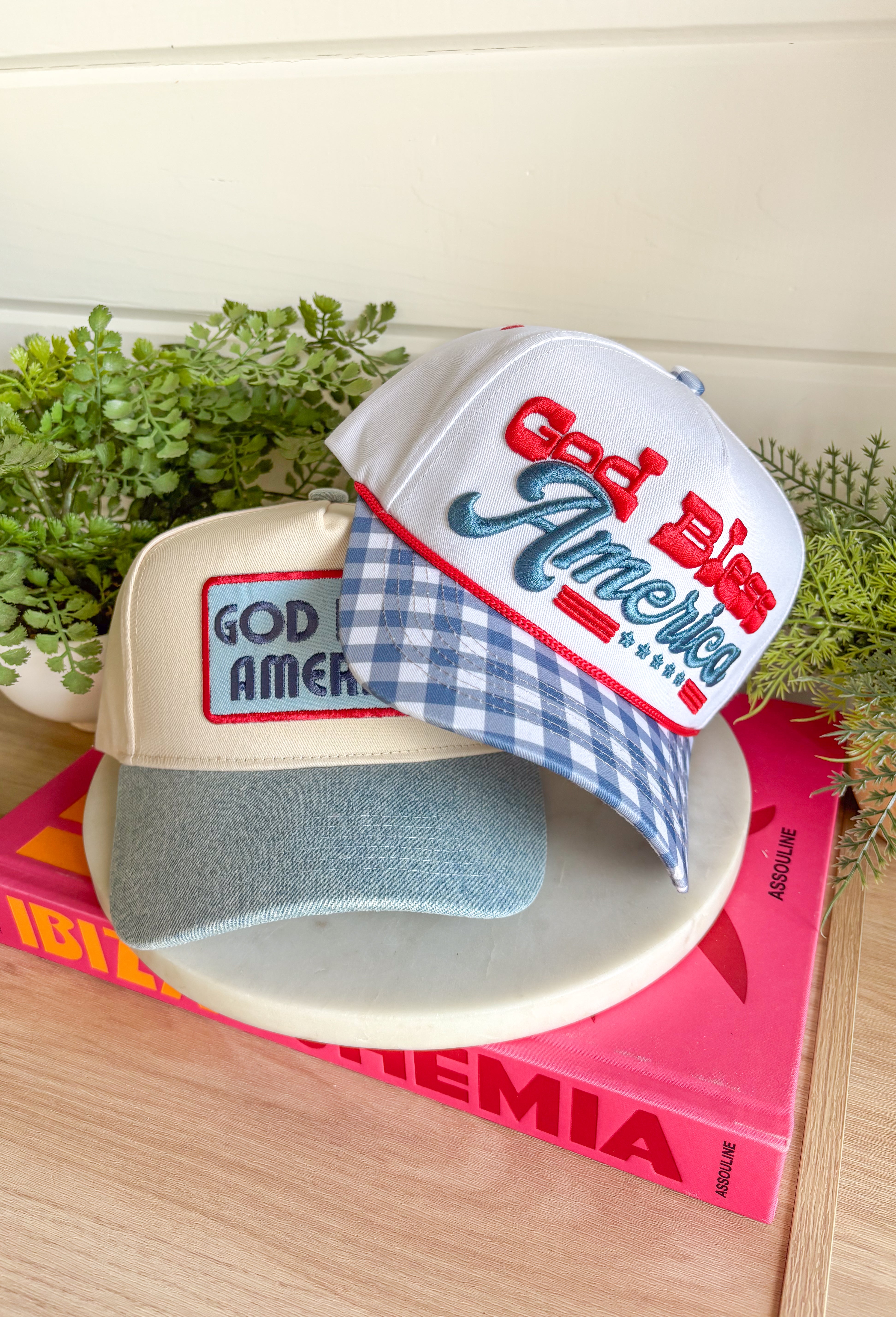 This white trucker hat with a blue gingham bill is the sweetest patriotic touch for your summer lineup! The embroidered “God Bless America” in red and blue adds a festive pop, while the gingham detail keeps it feeling fresh and fun. Perfect for the 4th of July, lake days, or backyard BBQs, this hat is both cute and practical with its breathable design and adjustable fit. It’s an easy way to pull your whole look together while staying cool in the sun. 