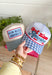 This white trucker hat with a blue gingham bill is the sweetest patriotic touch for your summer lineup! The embroidered “God Bless America” in red and blue adds a festive pop, while the gingham detail keeps it feeling fresh and fun. Perfect for the 4th of July, lake days, or backyard BBQs, this hat is both cute and practical with its breathable design and adjustable fit. It’s an easy way to pull your whole look together while staying cool in the sun. 