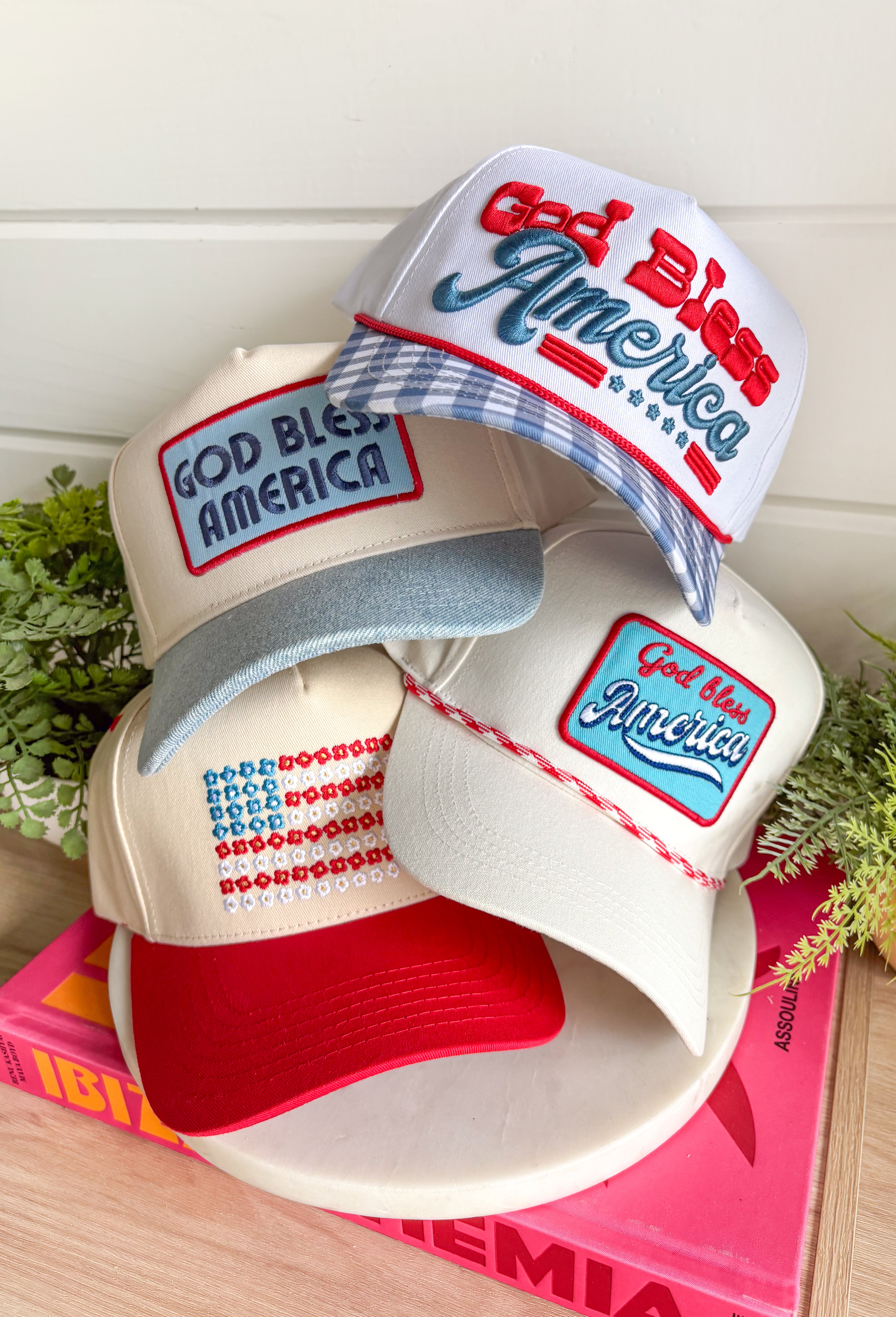 This white trucker hat with red and white trim is the perfect finishing touch for all your summer celebrations! The bold blue patch outlined in red with “God Bless America” adds that classic patriotic feel, while the subtle trim detail along the bill gives it a fun, standout edge. Designed with a adjustable fit, it’s made for long days in the sun—from 4th of July festivities to lake days and backyard BBQs. It’s an easy grab-and-go accessory that instantly pulls your look together. 
