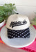 This “Athletic-ish” trucker hat is the perfect mix of cute and a little sarcastic—basically summer energy in one accessory. The neutral base keeps it easy to style, while the black embroidered lettering and polka dot bill add a fun, playful twist. It’s lightweight, breathable, and made for those busy, on-the-go days when you still want to look put together without trying too hard. Whether you're heading to a workout…or just thinking about it, this one gets it. 