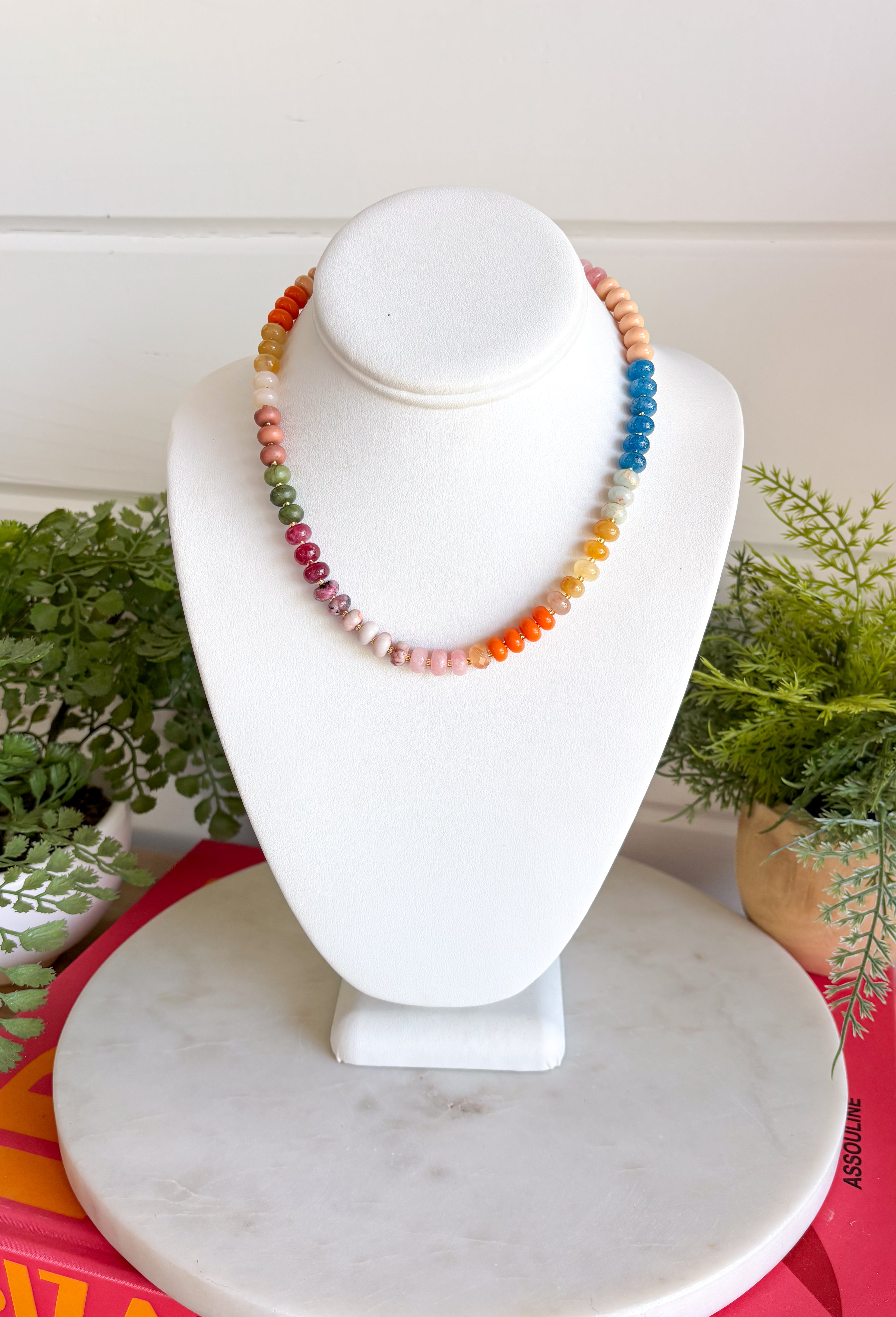 Complete your fall look with a necklace that captures the colors of the season! Featuring beautiful beads in rich shades of brown, pink, orange, teal, green, and purple, this timeless accessory adds the perfect finishing touch to everything from cozy sweaters to feminine blouses. Whether you're dressing up for dinner or adding a little extra charm to your everyday outfit, this versatile necklace is one you'll reach for all season long.