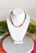 Complete your fall look with a necklace that captures the colors of the season! Featuring beautiful beads in rich shades of brown, pink, orange, teal, green, and purple, this timeless accessory adds the perfect finishing touch to everything from cozy sweaters to feminine blouses. Whether you're dressing up for dinner or adding a little extra charm to your everyday outfit, this versatile necklace is one you'll reach for all season long.