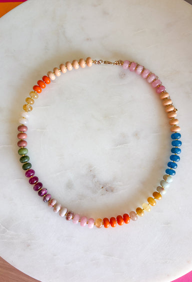 Complete your fall look with a necklace that captures the colors of the season! Featuring beautiful beads in rich shades of brown, pink, orange, teal, green, and purple, this timeless accessory adds the perfect finishing touch to everything from cozy sweaters to feminine blouses. Whether you're dressing up for dinner or adding a little extra charm to your everyday outfit, this versatile necklace is one you'll reach for all season long.