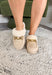 Stay stylish while keeping cozy with these neutral faux suede slippers. Lined with plush faux fur for extra warmth, they’re as comfortable as they are chic. The gold chain detail across the top adds a polished finish, making them perfect for lounging at home or slipping on for quick errands. With their true-to-size fit and soft construction, these slippers are the kind you’ll want to live in all season long.