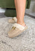 Stay stylish while keeping cozy with these neutral faux suede slippers. Lined with plush faux fur for extra warmth, they’re as comfortable as they are chic. The gold chain detail across the top adds a polished finish, making them perfect for lounging at home or slipping on for quick errands. With their true-to-size fit and soft construction, these slippers are the kind you’ll want to live in all season long.