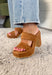 These brown platform sandals are the perfect combination of style and versatility! Designed in a rich faux suede finish, they bring a polished touch to any outfit while still feeling timeless enough to wear season after season. The block heel and platform design provide added comfort and stability, making them a go-to choice for weddings, date nights, game days, and everything in between. Their neutral color pairs effortlessly with dresses, denim, and tailored pieces, making outfit styling a breeze. 