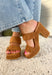 These brown platform sandals are the perfect combination of style and versatility! Designed in a rich faux suede finish, they bring a polished touch to any outfit while still feeling timeless enough to wear season after season. The block heel and platform design provide added comfort and stability, making them a go-to choice for weddings, date nights, game days, and everything in between. Their neutral color pairs effortlessly with dresses, denim, and tailored pieces, making outfit styling a breeze. 