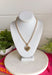 This gold chain necklace with a textured heart pendant is the perfect mix of bold and timeless for styling all season long! The toggle closure adds a unique, elevated touch, while the 18" length makes it ideal for layering or wearing as a statement on its own. The textured heart pendant gives it that eye-catching detail that instantly pulls an outfit together—whether you're in a simple tank or a breezy dress. It’s the kind of piece that feels special but still easy enough for everyday wear. 