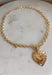 This gold chain necklace with a textured heart pendant is the perfect mix of bold and timeless for styling all season long! The toggle closure adds a unique, elevated touch, while the 18" length makes it ideal for layering or wearing as a statement on its own. The textured heart pendant gives it that eye-catching detail that instantly pulls an outfit together—whether you're in a simple tank or a breezy dress. It’s the kind of piece that feels special but still easy enough for everyday wear. 
