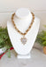 Make a statement with this beautifully crafted chain necklace that blends timeless elegance with modern style. Featuring a bold gold chain, this eye-catching piece is finished with a stunning heart pendant outlined in delicate pearls for the perfect mix of classic charm and sophistication. Whether worn on its own or layered with your favorite necklaces, this versatile accessory instantly elevates everything from cozy sweaters to dresses and blouses, making it a piece you'll treasure season after season.