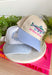 This trucker hat is made for long lake days, sunshine, and making memories by the water! Featuring a colorful embroidered fish and "Better By The Lake" stitched in bright pink, it brings all the fun summer vibes. The neutral crown keeps it easy to style, while the periwinkle bill adds the perfect pop of color. Whether you're spending the day on the boat, relaxing at the cabin, or heading out for a weekend getaway, this hat is the perfect finishing touch. 