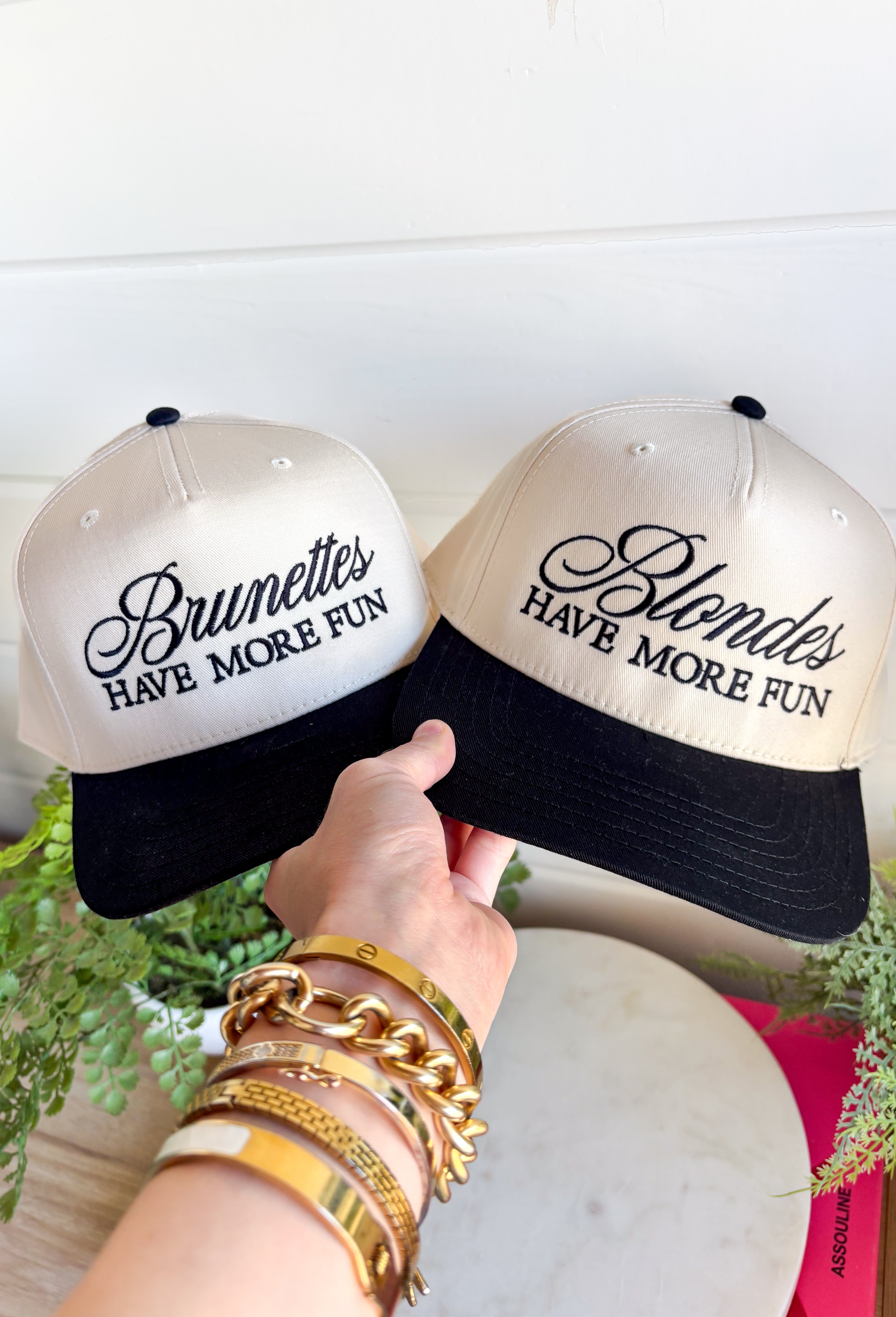 This trucker hat is bringing the attitude—in the best way! Featuring “Blondes Have More Fun” embroidered across the front, it’s the perfect mix of playful and a little bold. The tan base with a black bill keeps it easy to style, while the statement graphic does all the talking. Whether you're heading out for errands, a casual day with friends, or just embracing your blonde era, this hat adds that fun finishing touch. 