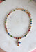 Add a meaningful touch of color to your jewelry collection with this beautiful cross necklace. Featuring a strand of colorful rhinestone crystals in shades of red, blue, green, pink, and gold, this eye-catching piece is finished with a matching cross pendant for the perfect blend of faith and style. The vibrant colors and delicate gold accents make it a standout accessory that's easy to wear for both everyday outfits and special occasions.