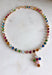 Add a meaningful touch of color to your jewelry collection with this beautiful cross necklace. Featuring a strand of colorful rhinestone crystals in shades of red, blue, green, pink, and gold, this eye-catching piece is finished with a matching cross pendant for the perfect blend of faith and style. The vibrant colors and delicate gold accents make it a standout accessory that's easy to wear for both everyday outfits and special occasions.