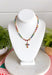 Add a meaningful touch of color to your jewelry collection with this beautiful cross necklace. Featuring a strand of colorful rhinestone crystals in shades of red, blue, green, pink, and gold, this eye-catching piece is finished with a matching cross pendant for the perfect blend of faith and style. The vibrant colors and delicate gold accents make it a standout accessory that's easy to wear for both everyday outfits and special occasions.