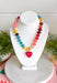 A little color and a lot of heart make this beaded necklace such a fun addition to your jewelry collection. Colorful beads in blue, yellow, burgundy, and pink create a playful mix, while the pink heart charm pendant adds an extra-sweet focal point. Finished with 18K gold-dipped details, it has just the right touch of shine to bring the whole look together. Wear it solo for a cheerful pop of color or layer it with your favorite gold necklaces for a fun, collected look.
