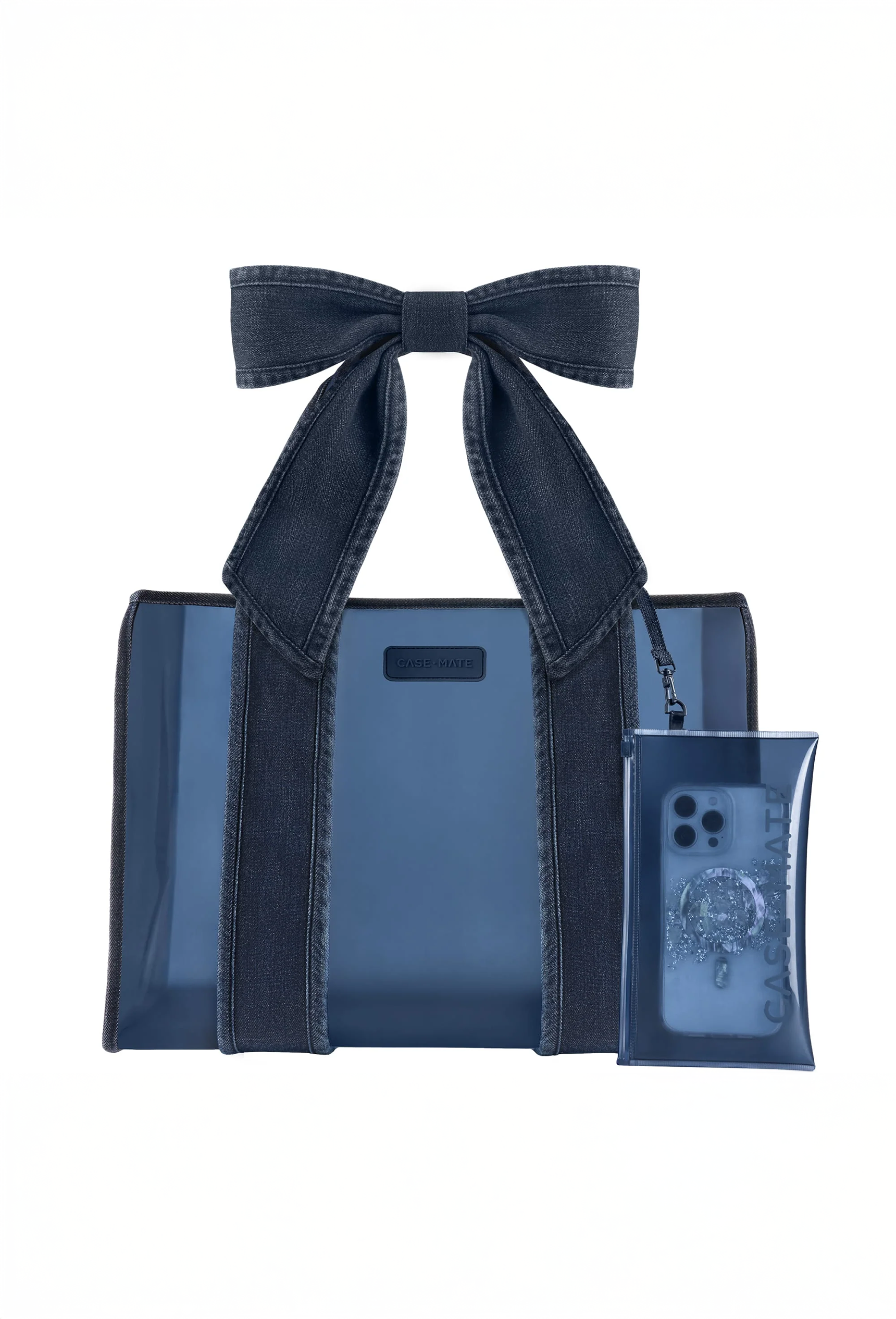 The Dark Wash Denim Bow Jelly Tote brings the timeless, laid-back charm of your favorite worn-in jeans to a bag you can take anywhere. Spacious yet lightweight, this bag is perfect for everything from errands and workdays to travel and workouts. Fold it flat when you need a little more room in your suitcase, use it as your carry-on, or fill it with your daily essentials. This large tote bag is made from jelly-like TPU material that’s waterproof, wipes clean with ease, and holds up over time. 