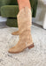 Step out in timeless Western style with the Merida Boot by Chinese Laundry. A fresh take on the classic cowgirl silhouette, this boot blends sleek lines with everyday comfort. Featuring a pointed toe, pull-on design, and a chic finish, it’s the perfect blend of rugged charm and modern flair. Whether you’re pairing it with denim, dresses, or cozy winter layers, the Merida is your new go-to boot for the season.