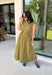 Meet your new throw-on-and-go favorite with this olive utility-inspired midi dress from Entro. The classic olive color keeps it versatile, while the zipper-front closure and adjustable waist give it a sporty, modern feel. A bubble hem adds shape and a fun unexpected finish, while the sleeveless silhouette makes it easy to wear now and layer as the temperatures cool down. Complete with convenient side pockets, this dress is ready for busy workdays, weekend plans, travel days, and everything in between.