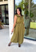 Meet your new throw-on-and-go favorite with this olive utility-inspired midi dress from Entro. The classic olive color keeps it versatile, while the zipper-front closure and adjustable waist give it a sporty, modern feel. A bubble hem adds shape and a fun unexpected finish, while the sleeveless silhouette makes it easy to wear now and layer as the temperatures cool down. Complete with convenient side pockets, this dress is ready for busy workdays, weekend plans, travel days, and everything in between.