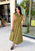 Meet your new throw-on-and-go favorite with this olive utility-inspired midi dress from Entro. The classic olive color keeps it versatile, while the zipper-front closure and adjustable waist give it a sporty, modern feel. A bubble hem adds shape and a fun unexpected finish, while the sleeveless silhouette makes it easy to wear now and layer as the temperatures cool down. Complete with convenient side pockets, this dress is ready for busy workdays, weekend plans, travel days, and everything in between.