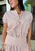 Add a fresh twist to your fall wardrobe with this light pink striped top from Day + Moon. The warm brown stripe print gives the soft pink color an autumn-ready feel, while the front zipper adds a fun, modern detail. Elastic at the hem and sleeves creates a comfortable shape that's easy to wear throughout the day. Pair it with the matching midi skirt for a coordinated two-piece set, or style it on its own with your favorite denim or chocolate brown bottoms.