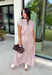 Add a fresh twist to your fall wardrobe with this light pink striped top from Day + Moon. The warm brown stripe print gives the soft pink color an autumn-ready feel, while the front zipper adds a fun, modern detail. Elastic at the hem and sleeves creates a comfortable shape that's easy to wear throughout the day. Pair it with the matching midi skirt for a coordinated two-piece set, or style it on its own with your favorite denim or chocolate brown bottoms.