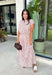 Soft pink meets warm brown in this charming midi skirt from Day + Moon. Featuring a classic stripe print, this feminine skirt brings a fresh pop of color to your fall wardrobe while still feeling easy and versatile. A zipper closure creates a clean, polished finish, while the midi length makes it perfect for everything from workdays and brunch dates to seasonal gatherings.