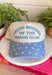 Wear your badge of honor with a smile in this playful trucker hat. Featuring "Proud Member Of The Chaos Club" embroidered in a classic denim blue, this hat is made for busy days, endless to-do lists, and embracing every bit of the fun along the way. The denim blue bill with an off white polka dot print adds a charming vintage-inspired touch, making it the perfect accessory for school drop-offs, errands, weekend adventures, and everything in between.