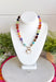 Rich autumn tones and elegant details come together in this stunning statement necklace. Featuring shades of brown with beautiful pops of pink, teal, green, purple, and rust, this beaded design is accented with delicate gold spacer beads that add the perfect touch of shine. The mother-of-pearl heart pendant framed in gold creates a timeless focal point, while the toggle detail and lobster clasp complete this effortlessly elevated accessory. It's the perfect finishing touch for all your favorite fall looks.
