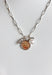 First Glances Necklace in Silver, Silver paper clip chain necklace with rhinestone, coin, and pearl charm in the center