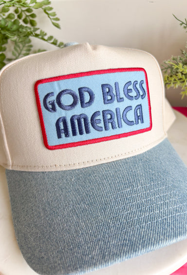 This neutral trucker hat with a denim bill and “God Bless America” patch is made for all your summer celebrations! Featuring a bold blue patch outlined in red, it brings the perfect patriotic touch—just in time for the 4th of July and beyond. The light wash denim bill adds a casual, laid-back feel, while the adjustable fit and breathable design keep it comfortable for all-day wear. Whether you're heading to fireworks, a backyard BBQ, or a lake day, this hat is the perfect finishing touch. 