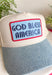 This neutral trucker hat with a denim bill and “God Bless America” patch is made for all your summer celebrations! Featuring a bold blue patch outlined in red, it brings the perfect patriotic touch—just in time for the 4th of July and beyond. The light wash denim bill adds a casual, laid-back feel, while the adjustable fit and breathable design keep it comfortable for all-day wear. Whether you're heading to fireworks, a backyard BBQ, or a lake day, this hat is the perfect finishing touch. 