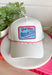 This white trucker hat with red and white trim is the perfect finishing touch for all your summer celebrations! The bold blue patch outlined in red with “God Bless America” adds that classic patriotic feel, while the subtle trim detail along the bill gives it a fun, standout edge. Designed with a adjustable fit, it’s made for long days in the sun—from 4th of July festivities to lake days and backyard BBQs. It’s an easy grab-and-go accessory that instantly pulls your look together. 