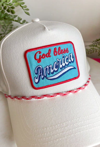 This white trucker hat with red and white trim is the perfect finishing touch for all your summer celebrations! The bold blue patch outlined in red with “God Bless America” adds that classic patriotic feel, while the subtle trim detail along the bill gives it a fun, standout edge. Designed with a adjustable fit, it’s made for long days in the sun—from 4th of July festivities to lake days and backyard BBQs. It’s an easy grab-and-go accessory that instantly pulls your look together. 