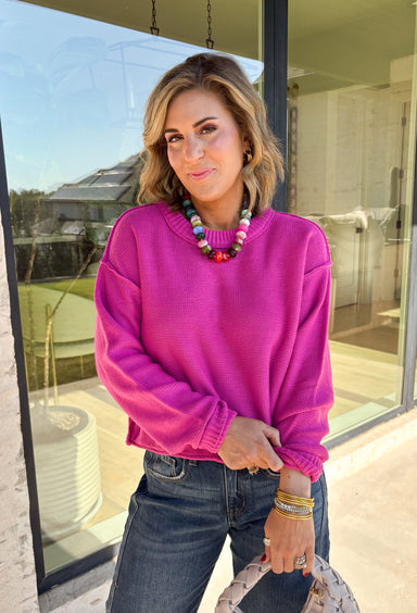 Nothing says cozy season like a classic fuchsia sweater, and this timeless knit from Double Zero is one you'll reach for again and again. Designed in a fuchsia hue, this effortlessly versatile sweater features exposed seam detailing that adds a modern touch to its classic silhouette. Ribbed trim at the neckline and cuffs provides a polished finish, while the soft knit construction keeps you warm and comfortable all day long.