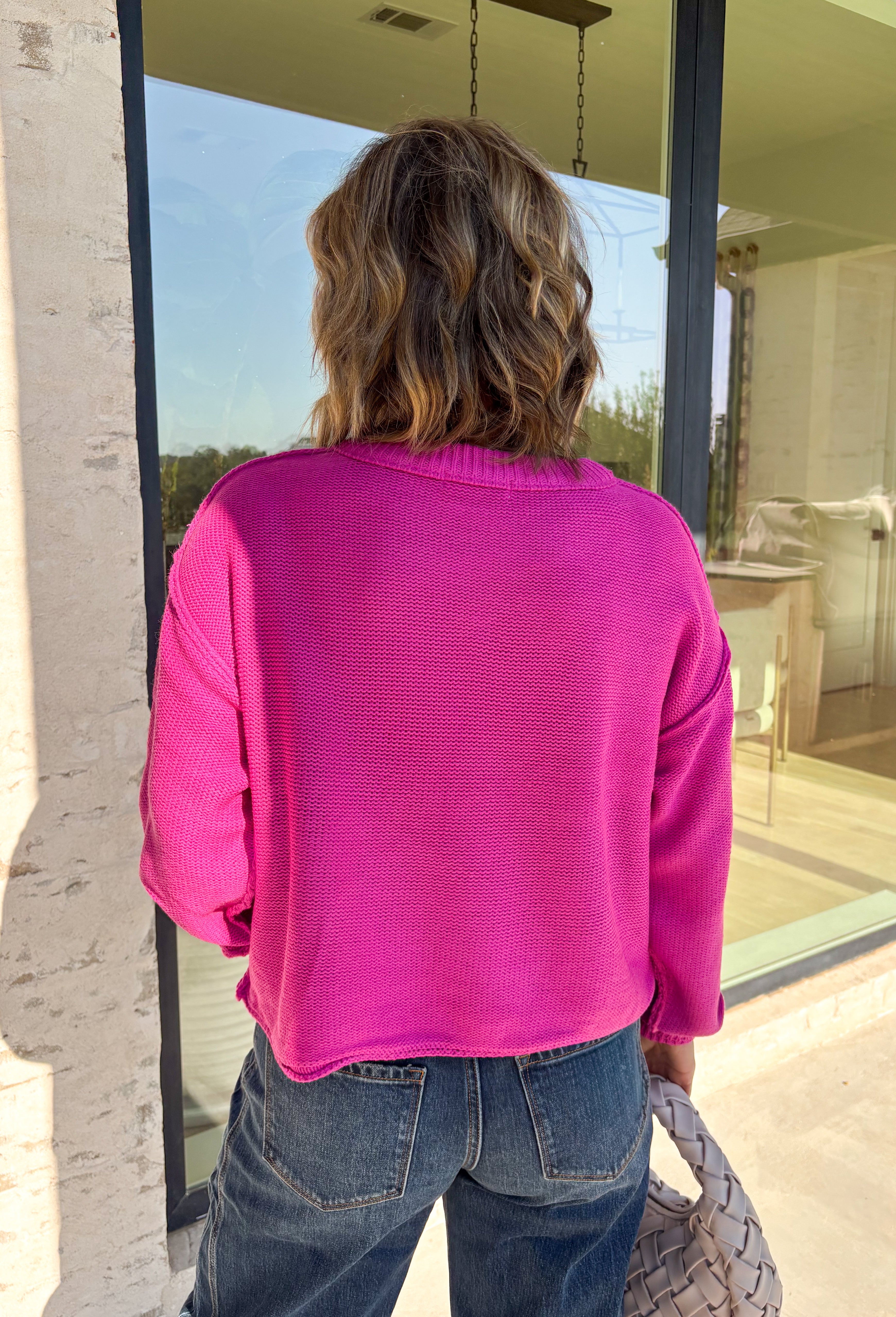 Nothing says cozy season like a classic fuchsia sweater, and this timeless knit from Double Zero is one you'll reach for again and again. Designed in a fuchsia hue, this effortlessly versatile sweater features exposed seam detailing that adds a modern touch to its classic silhouette. Ribbed trim at the neckline and cuffs provides a polished finish, while the soft knit construction keeps you warm and comfortable all day long.