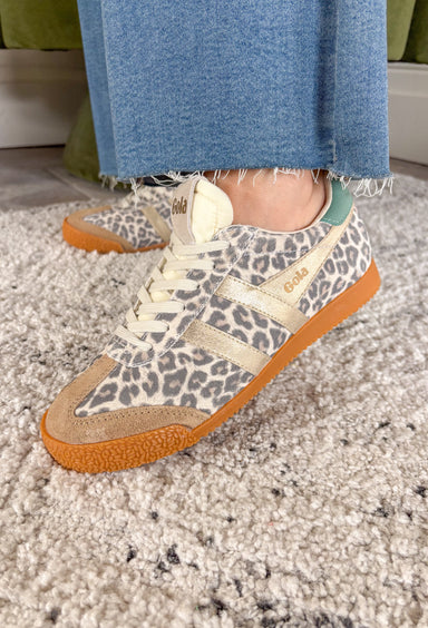 A fan favorite with a bold new twist! The Gola Elan Safari sneaker brings a fresh update to a classic silhouette with its all-over snow leopard print suede. The rich mix of caramel, gold, and green tones adds warmth and dimension, making this pair a standout while still feeling easy to style. Blending heritage-inspired design with a modern edge, this sneaker delivers both comfort and personality. 