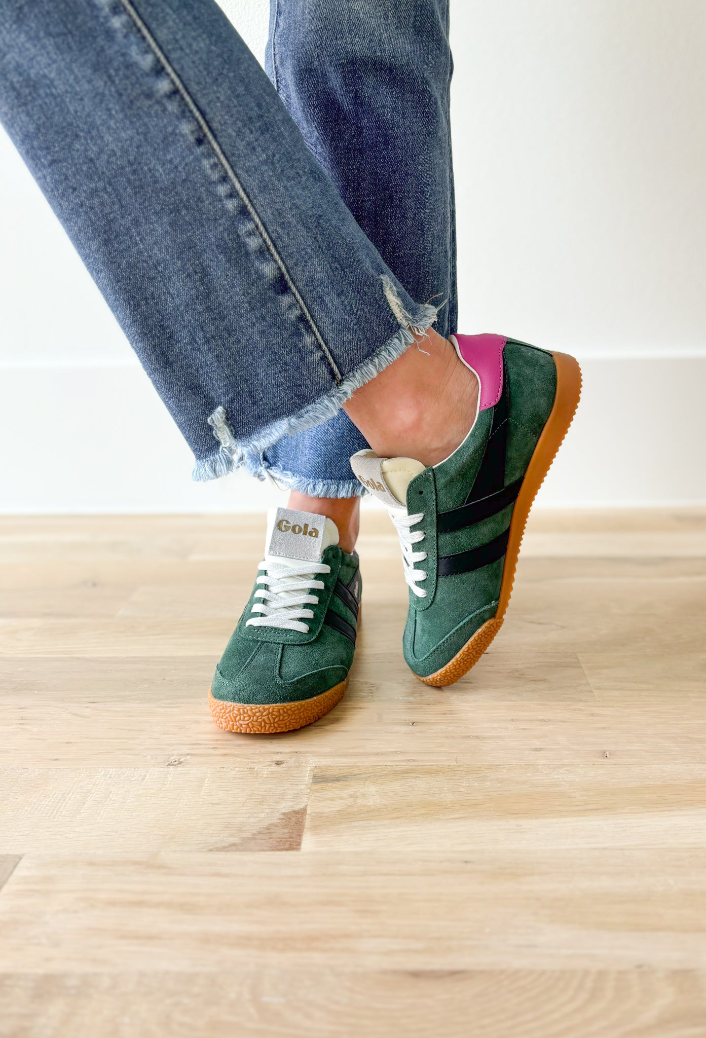 Gola Elan Sneakers in Evergreen, Evergreen samba style sneaker with black stripes, gum sole, white tongue and laces, Fuchsia back tab with gold "gola"