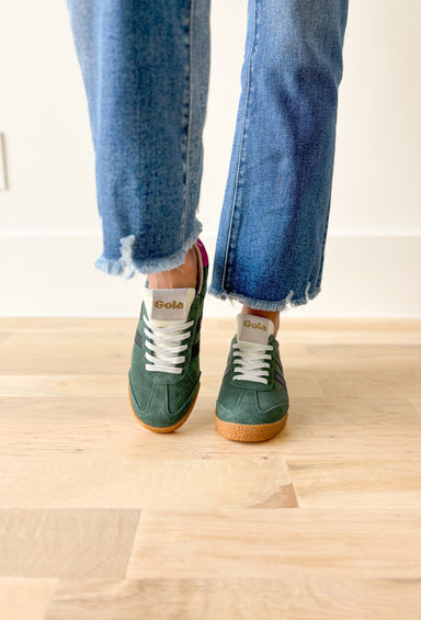 Gola Elan Sneakers in Evergreen, Evergreen samba style sneaker with black stripes, gum sole, white tongue and laces, Fuchsia back tab with gold "gola"