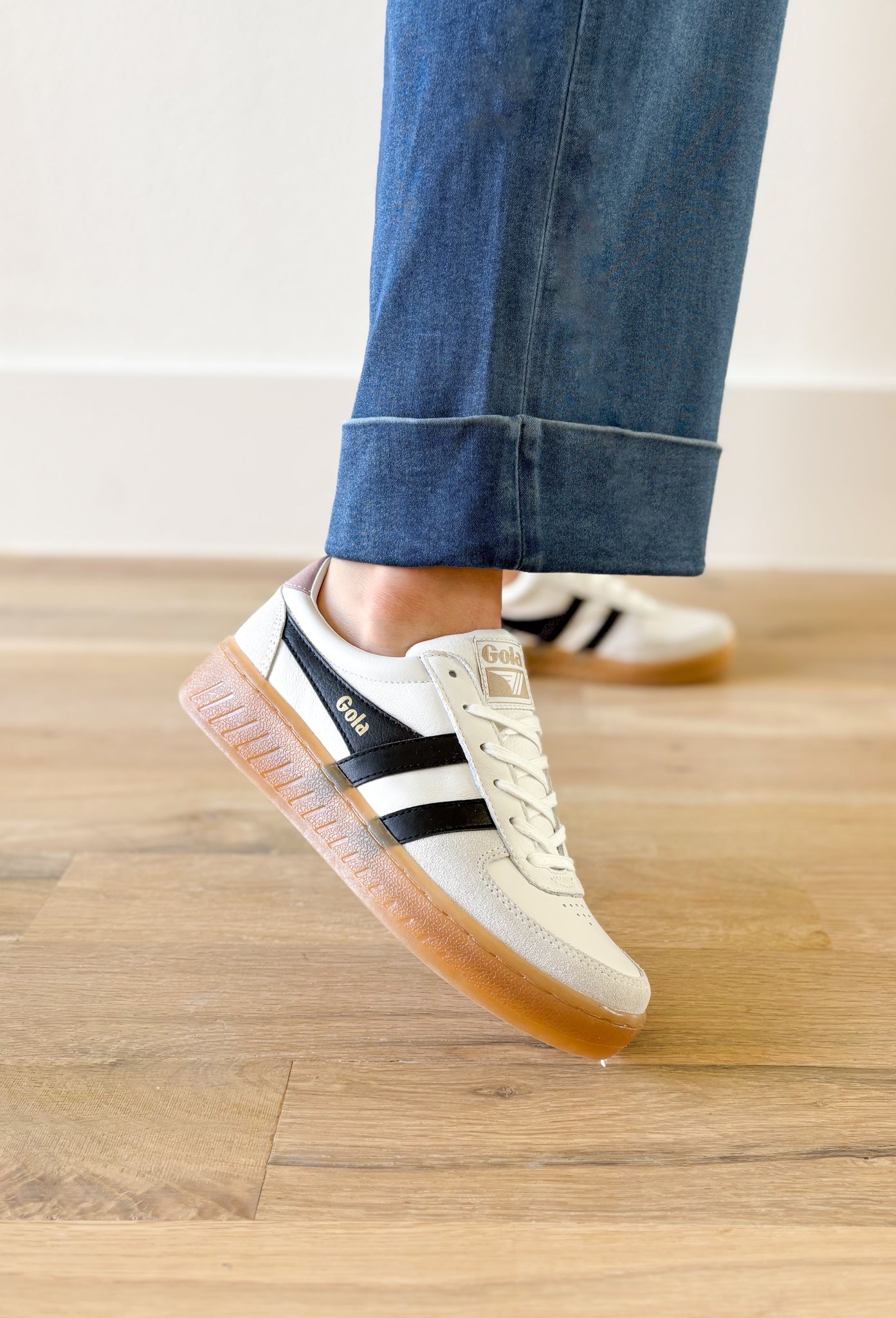 Gola Grandslam Elite Sneakers in Chalk Pink, white sneaker with black stripes on the side, off white suede around the toe and heel, light blush color on the top of the heel, gum sole 