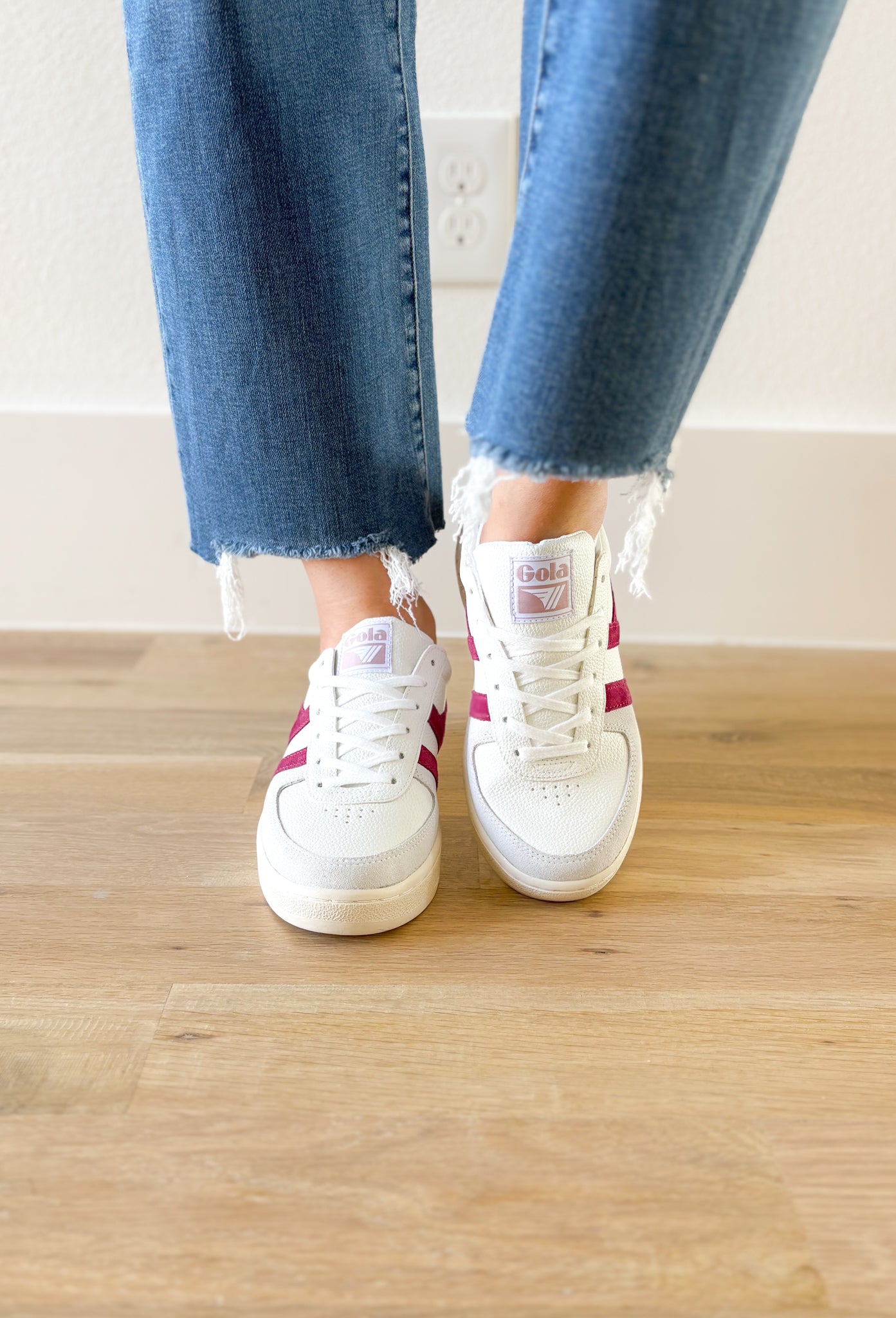 Gola Grandslam Trident Sneakers in Chalk Pink, white sneaker with light grey suede around the toe, hot fuchsia stripes, taupe on the heel, and a faded blush on the top of the heel 