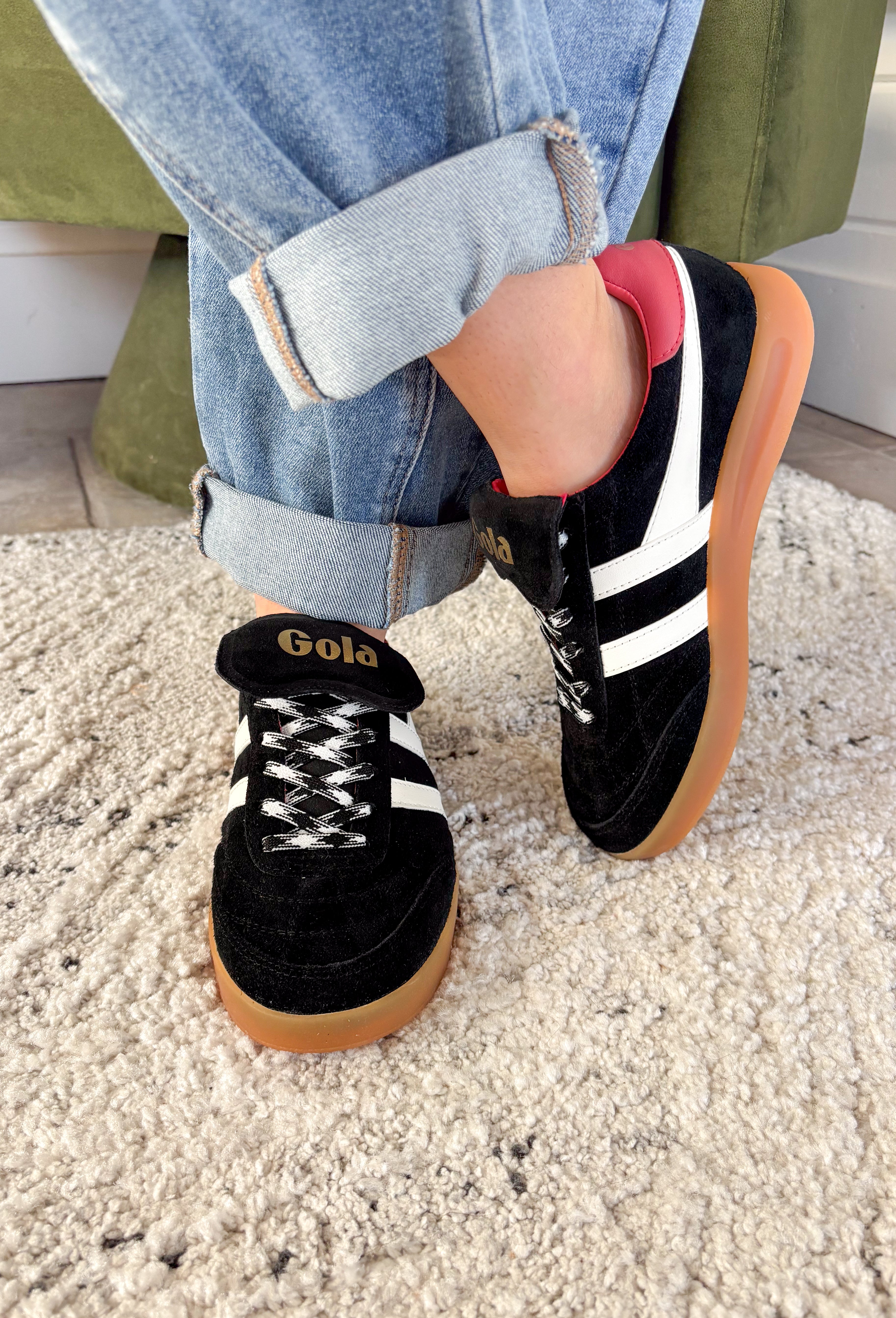 The Stadia ‘86 sneaker takes inspiration from Gola’s archives with a retro football silhouette reimagined for today. Crafted with a black suede upper, this style features check laces, a gum cup sole, and the brand’s signature off-white wingflash trim. A fold-over tongue and dark brown tab finish the design, giving it a true vintage feel with modern wearability. A standout sneaker that’s ready to bring bold, heritage style to your everyday looks.