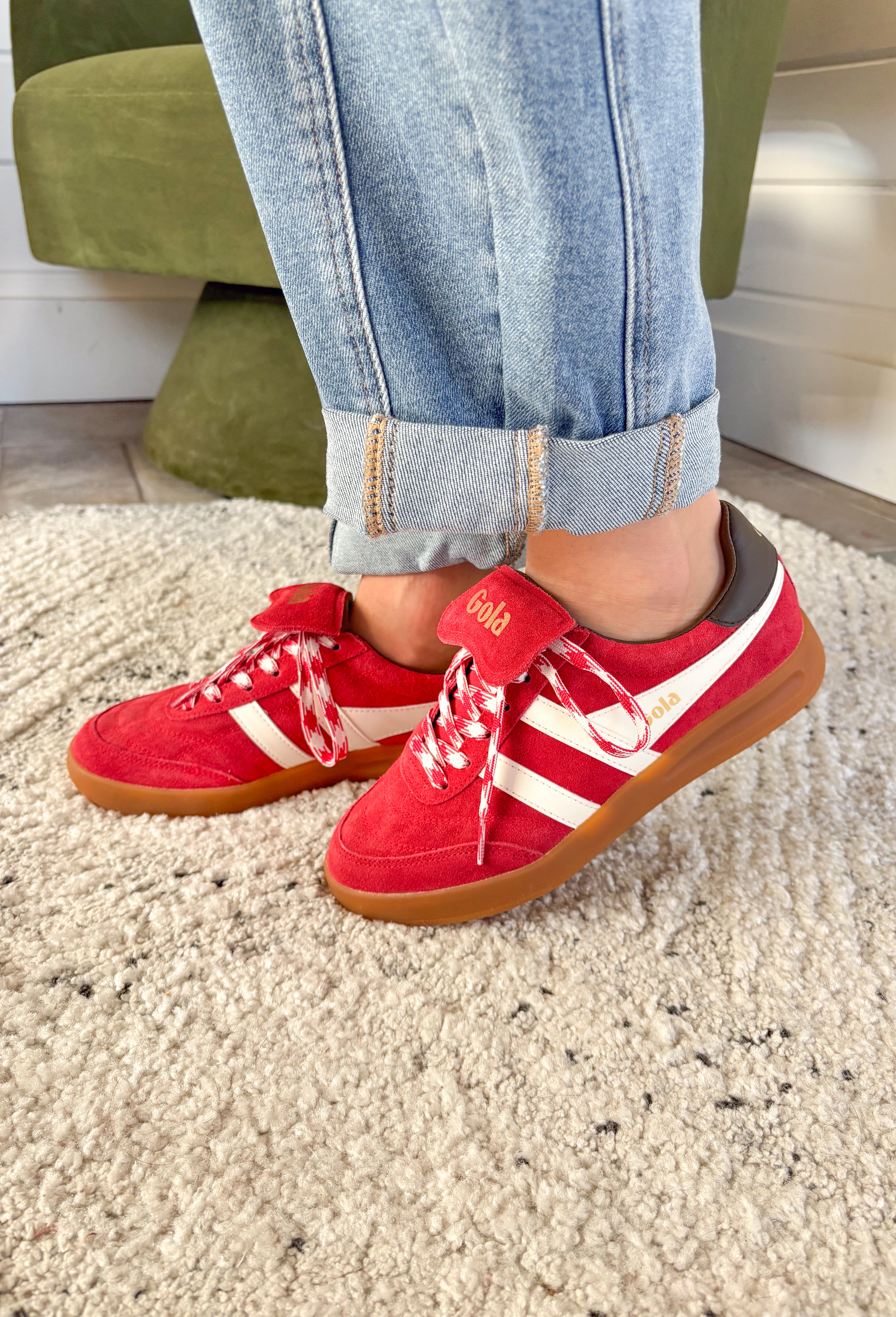 The Stadia ‘86 sneaker takes inspiration from Gola’s archives with a retro football silhouette reimagined for today. Crafted with a rich red suede upper, this style features check laces, a gum cup sole, and the brand’s signature off-white wingflash trim. A fold-over tongue and dark brown tab finish the design, giving it a true vintage feel with modern wearability. A standout sneaker that’s ready to bring bold, heritage style to your everyday looks.