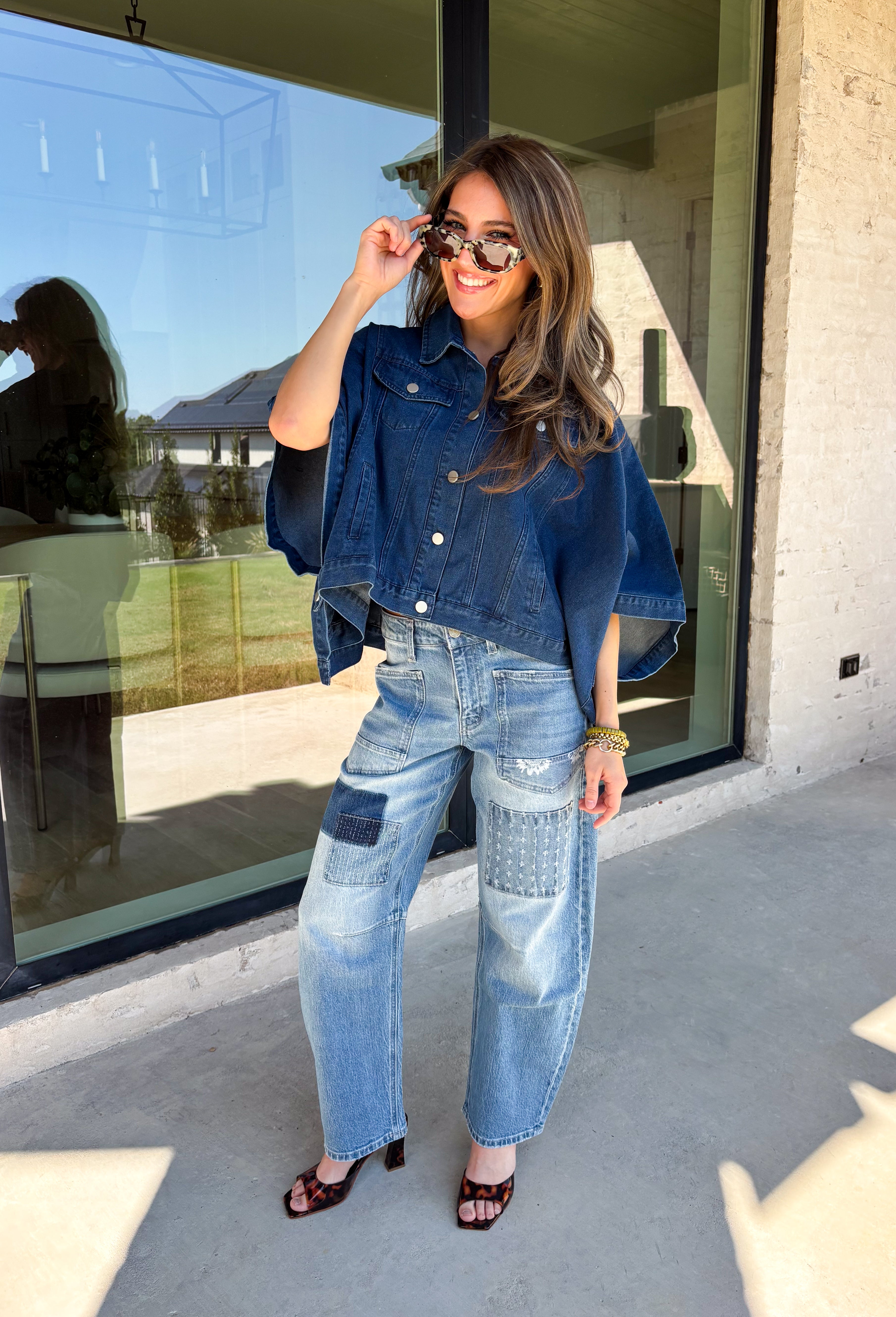 Give your everyday layers a fresh update with this dark wash denim jacket from Entro. The rich denim wash brings a classic feel to the relaxed, draped silhouette, making it an easy piece to throw on when your outfit needs a little something extra. Snap buttons down the front keep the look casual, while chest pockets and additional front pockets add functional detail. Snap button closures at the sides give the design an unexpected finishing touch while complementing its easygoing shape. 