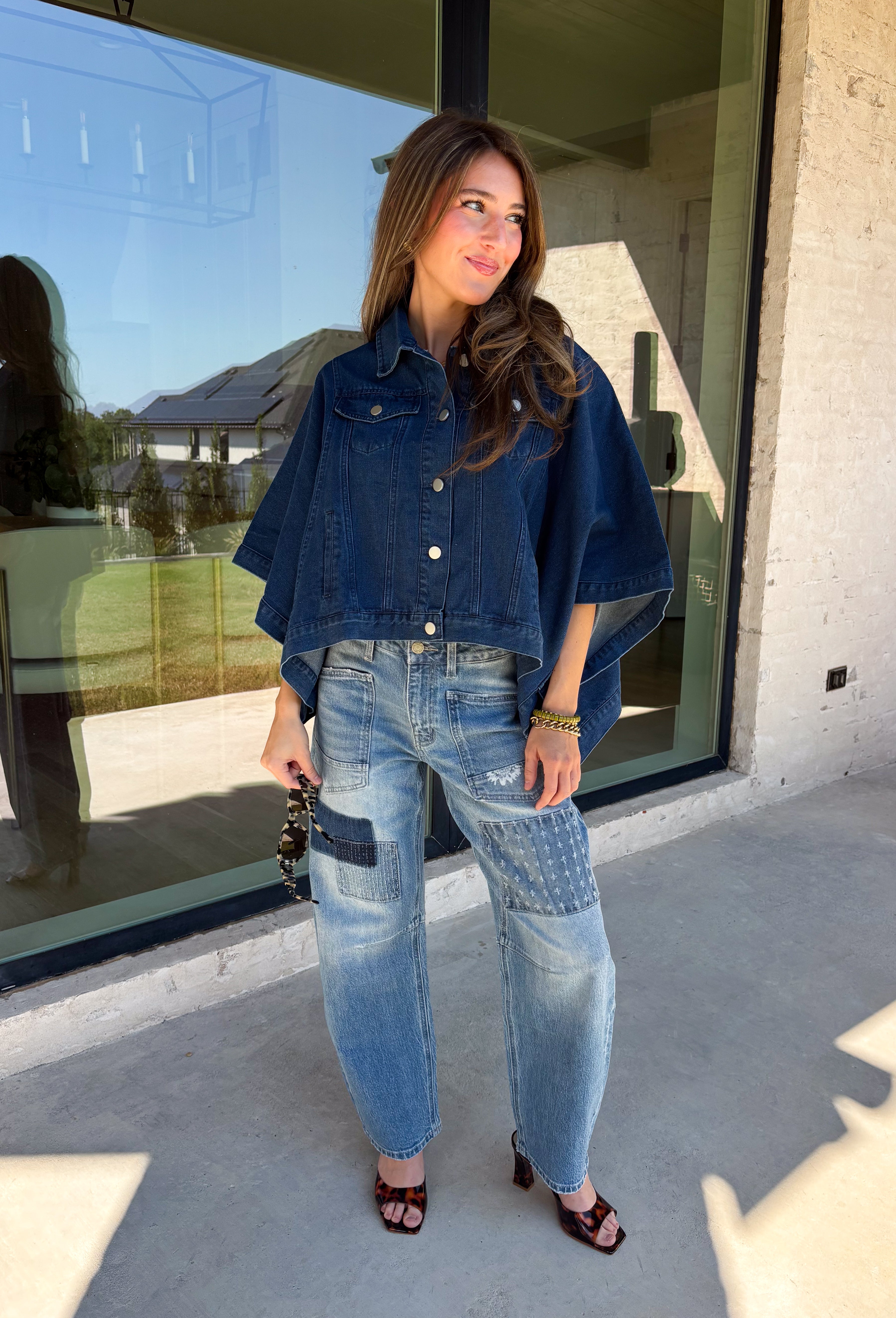 Give your everyday layers a fresh update with this dark wash denim jacket from Entro. The rich denim wash brings a classic feel to the relaxed, draped silhouette, making it an easy piece to throw on when your outfit needs a little something extra. Snap buttons down the front keep the look casual, while chest pockets and additional front pockets add functional detail. Snap button closures at the sides give the design an unexpected finishing touch while complementing its easygoing shape. 