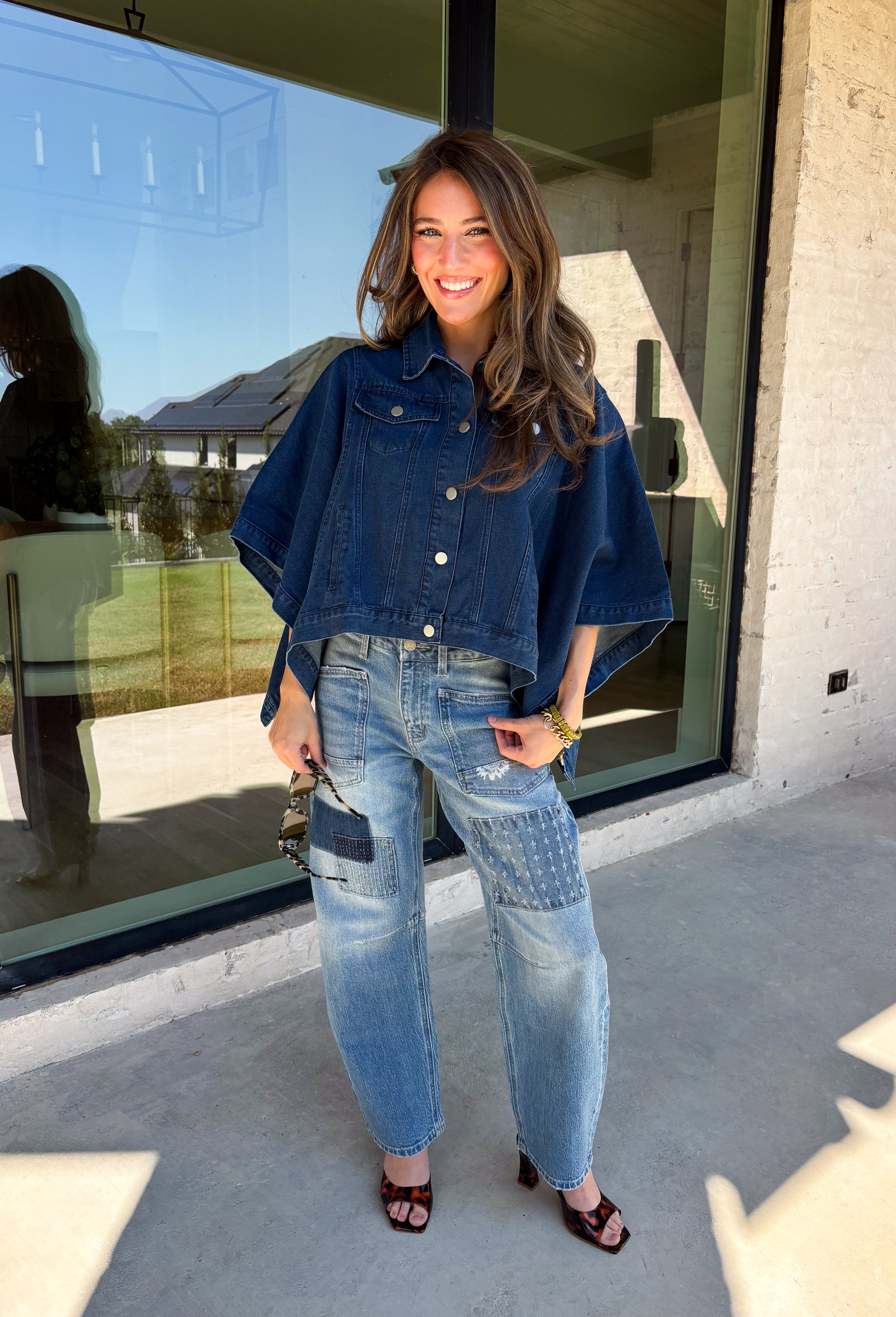Give your everyday layers a fresh update with this dark wash denim jacket from Entro. The rich denim wash brings a classic feel to the relaxed, draped silhouette, making it an easy piece to throw on when your outfit needs a little something extra. Snap buttons down the front keep the look casual, while chest pockets and additional front pockets add functional detail. Snap button closures at the sides give the design an unexpected finishing touch while complementing its easygoing shape. 