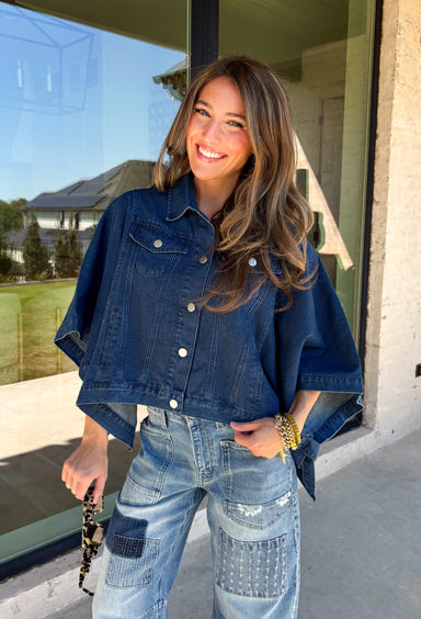 Give your everyday layers a fresh update with this dark wash denim jacket from Entro. The rich denim wash brings a classic feel to the relaxed, draped silhouette, making it an easy piece to throw on when your outfit needs a little something extra. Snap buttons down the front keep the look casual, while chest pockets and additional front pockets add functional detail. Snap button closures at the sides give the design an unexpected finishing touch while complementing its easygoing shape. 