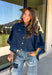 Give your everyday layers a fresh update with this dark wash denim jacket from Entro. The rich denim wash brings a classic feel to the relaxed, draped silhouette, making it an easy piece to throw on when your outfit needs a little something extra. Snap buttons down the front keep the look casual, while chest pockets and additional front pockets add functional detail. Snap button closures at the sides give the design an unexpected finishing touch while complementing its easygoing shape. 